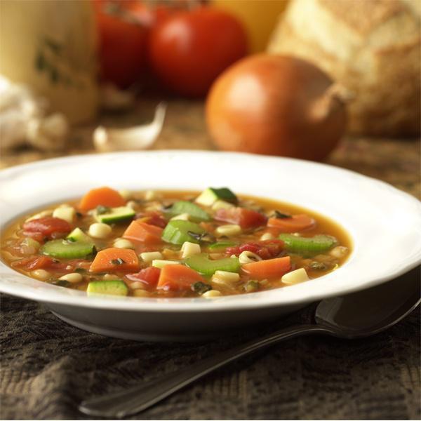 Minestrone Soup · Made with a light tomato stock and a mixture of beans, pasta and a medley of vegetables slowly simmered to perfection.