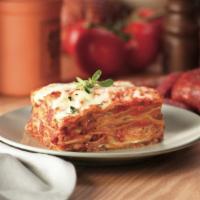 Lasagna · Pasta layered with ground beef, ricotta cheese and Italian herbs topped with homemade marina...