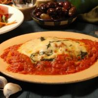 Eggplant Parmigiana Dinner · Lightly breaded pan-fried eggplant topped with our homemade marinara sauce. Made to order an...
