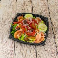 Tossed salad · Mixed greens with tomato wedges, cucumbers, green peppers, Greek olives and red onions. Serv...