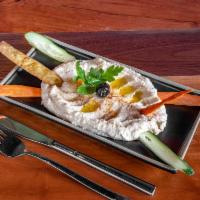 Humus  · Hummus. Chick peas mashed into a paste with lemon juice and flavored with tahini.