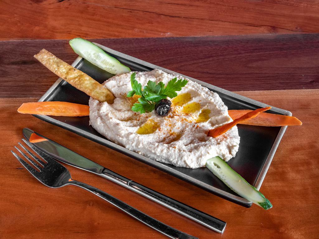 Humus  · Hummus. Chick peas mashed into a paste with lemon juice and flavored with tahini.