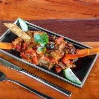 Sauced Eggplant · Sauced eggplant. Small pieces of eggplant in moderately spicy sauce tomatoes, green peppers,...