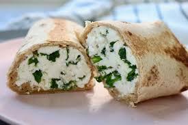 Egg White Protein Wrap · Three egg whites with turkey, spinach and cheddar cheese on a wrap.
