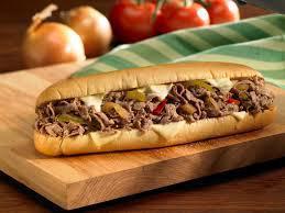 Philly Cheese Steak Sandwich · Sliced marinated steak, peppers, onions & melted swiss cheese on a hero.
