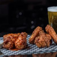 Chicken Wings Basket · 8 Crispy wings with your choice of being tossed in a sauce or plain. Served with ranch or bl...