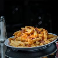Chili Cheese Fries · Crispy fries smothered with chili, Monterey jack cheese and diced onions.