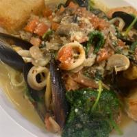 Seafood Florentine · Shrimp, calamri, mussels, sauteed spinach, tomatoes, and mushrooms cooked in a white wine re...