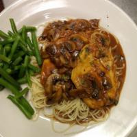 Chicken Marsala · Chicken breast lightly dredged in flour and suateed with mushrooms, in a marsala wine reduct...