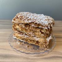 Napoleon Cake · Flakey layers with vanilla custard cream.