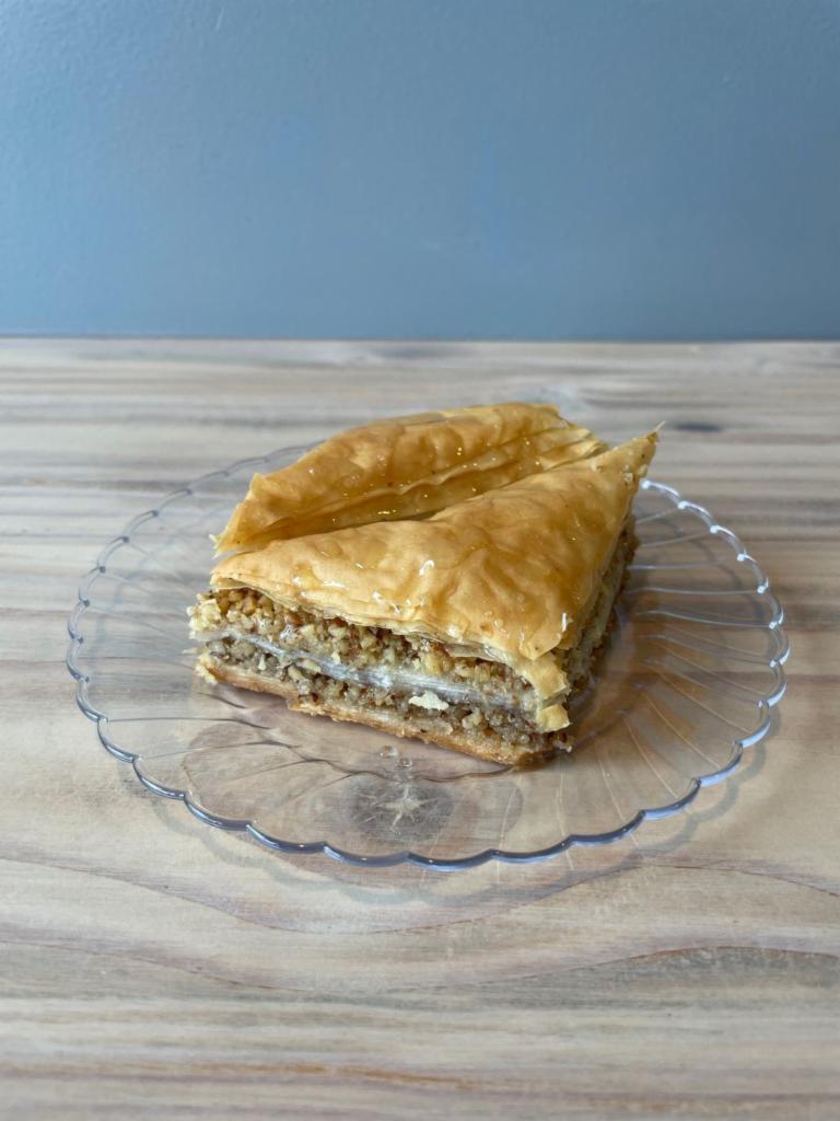 Baklava · Layered pastry made of filo pastry, filled with chopped nuts, and sweetened with honey syrup. 