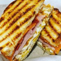 Big Dog Sandwich · 2 eggs over medium with ham, bacon, and cheddar cheese served on our fresh panini bread.