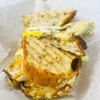 Onny Sandwich · 2 fried eggs, bacon, Swiss cheese, avocado, chipotle ranch on multigrain bread.