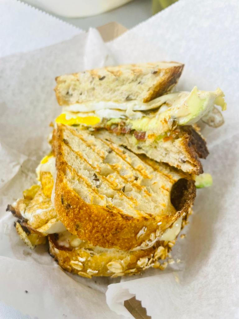 Onny Sandwich · 2 fried eggs, bacon, Swiss cheese, avocado, chipotle ranch on multigrain bread.