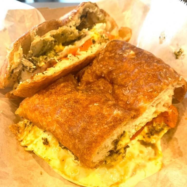Sully Sandwich · Fried eggs, roasted tomatoes, avocado, goat cheese, pesto on amazing grains salty bread.