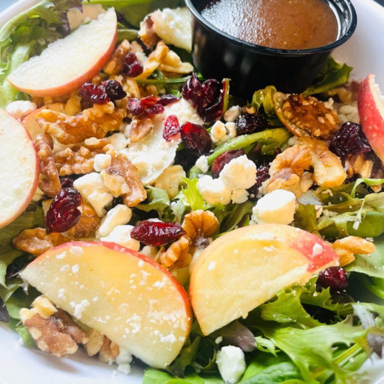 MSC Winter Salad · Spring mix, sliced apples, dried cranberries, walnuts, and goat cheese with balsamic vinaigrette dressing.