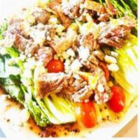Filet Wedge Salad · 8 oz. beef filet sliced and served on top of romaine wedge with grape tomatoes, bacon, crumb...