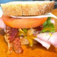 Lehigh Sandwich · Sliced turkey, honey ham, bacon, romaine lettuce, tomato, and house-made honey mustard dress...
