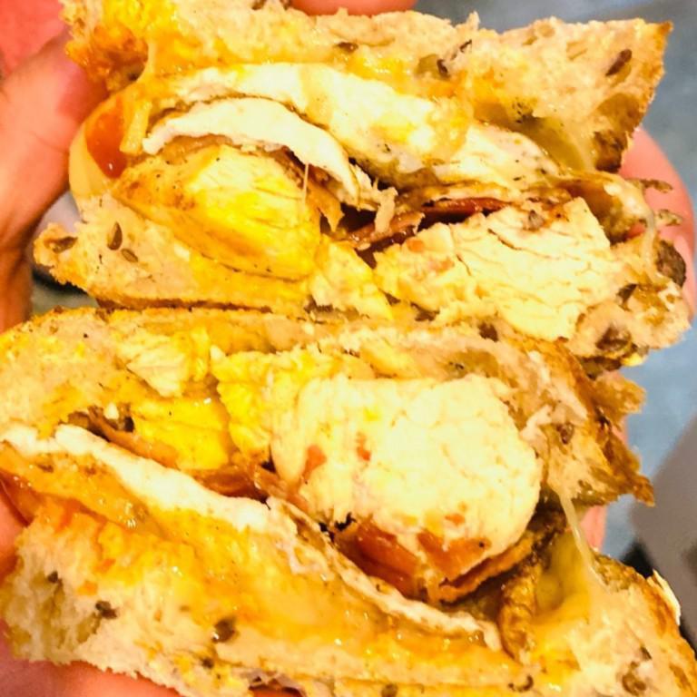 Samson Panini · Grilled chicken, 2 fried eggs, bacon, Sriracha, and cheddar cheese on multigrain bread.