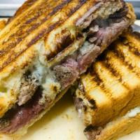 Filet Mignon Panini · Our first and most popular special. 8 oz. filet sliced and topped with bacon and our bleu ch...
