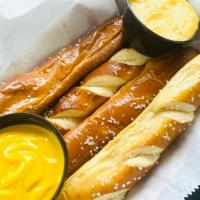 Soft Pretzel · Served with cheese and mustard.