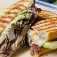 Avocado Stinger Panini · chicken, steak, bacon, avocado, swiss and spicy mayo panini...served w chips and pickle