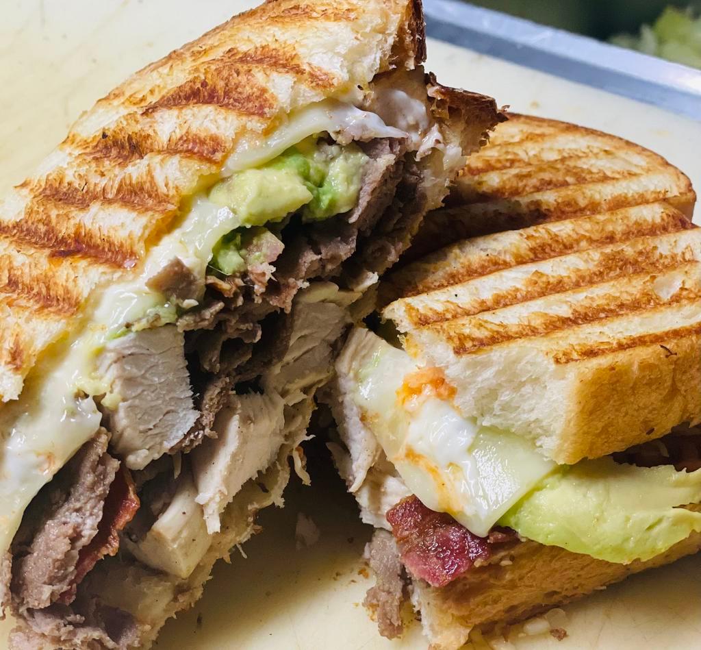 Avocado Stinger Panini · chicken, steak, bacon, avocado, swiss and spicy mayo panini...served w chips and pickle