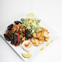 Parrilla Mar y Tierra · Grilled slices of steak, chicken, and shrimp. Sauteed squids, and bell pepper, and onions. S...