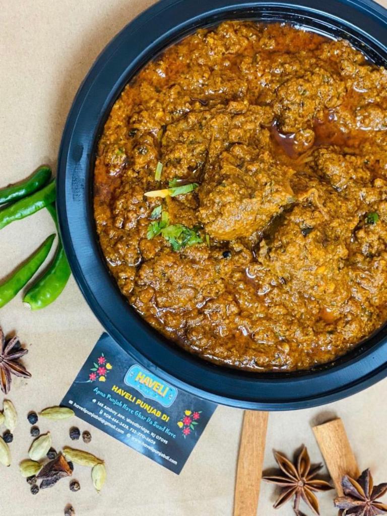 'Rarha' Goat Curry · baby goat in a brown 'bolognese style' gravy with goat 'keema'