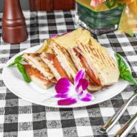Chicken Club · Roast chicken, bacon, Brie cheese, tomato and mayo. Served with chips and choice of drink.