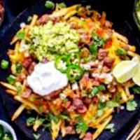 Carne asada fries · Large portion of French fries smothered with delicious carne asada ,Colby jack and nacho che...