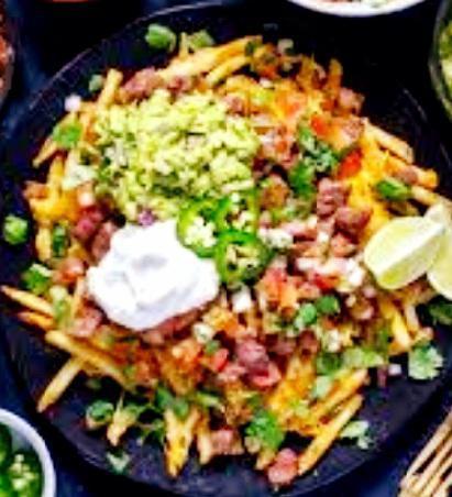 Carne asada fries · Large portion of French fries smothered with delicious carne asada ,Colby jack and nacho cheese, sour cream, guacamole and fresh pico de gallo