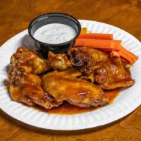 Honey BBQ Wings · 12 crispy deep fried chicken wings tossed in our house-made honey BBQ sauce served with cele...