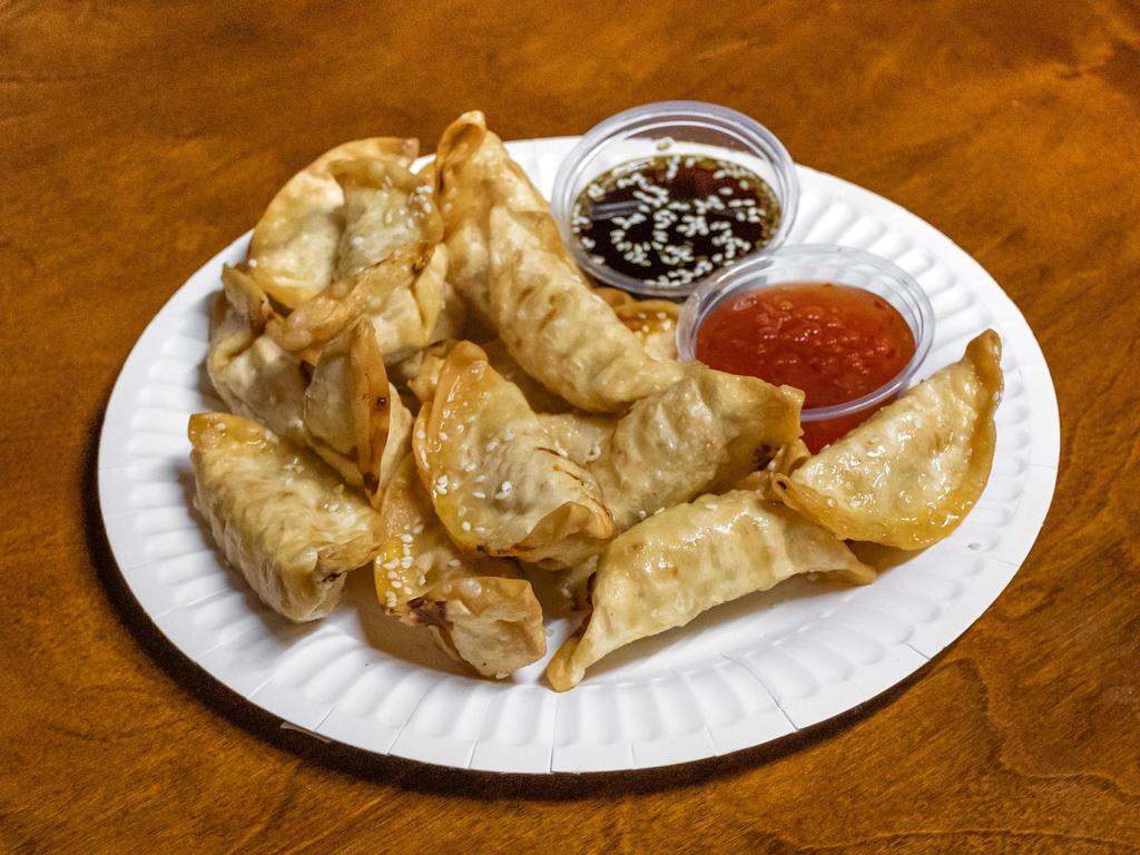 Pot Stickers · 15 chicken and vegetable deep fried pot stickers served with honey sesame teriyaki sauce and sweet and spicy general sauce.