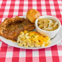 Smothered Pork Chops  · Includes choice of 2 sides.