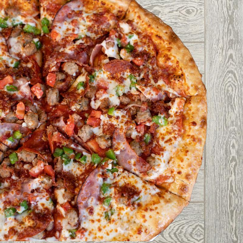 Nasty Boy Pizza · Pepperoni, Italian sausage, ham, beef, breakfast bacon and your choice of two vegetable toppings. 