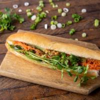 Egg Sandwich · Baguette roll, margarine, cucumber, jalapeño topped with pickled carrot, cilantro, green oni...
