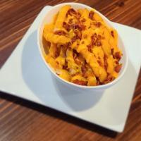 Bow Wow Fries · Crispy Coated Seasoned Fries topped with Cheese & Bacon with a side of Ranch