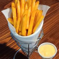 Cheese Fries · Crispy Battered Seasoned Fries.  Served with a side of Mexican Queso Sauce.