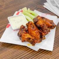 6 Wings · 6 Marinated & Fried Wings. Served plain or tossed in your choice of sauce. Served with a sid...