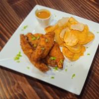 Chicken Fingers & Homemade Chips · Marinated, Breaded and Fried Chicken Fingers served with our Homemade Potato Chips