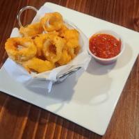 Calamari · Marinated in Buttermilk,  breaded & fried. Served with a side of Homemade Marinara Sauce