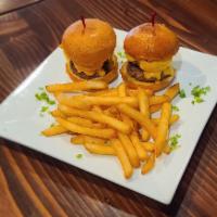 Smashed Burger Sliders · Order of 2 double patties topped with Lettuce, Tomatoes, Pickles on a toasted Brioche Bun. 
...