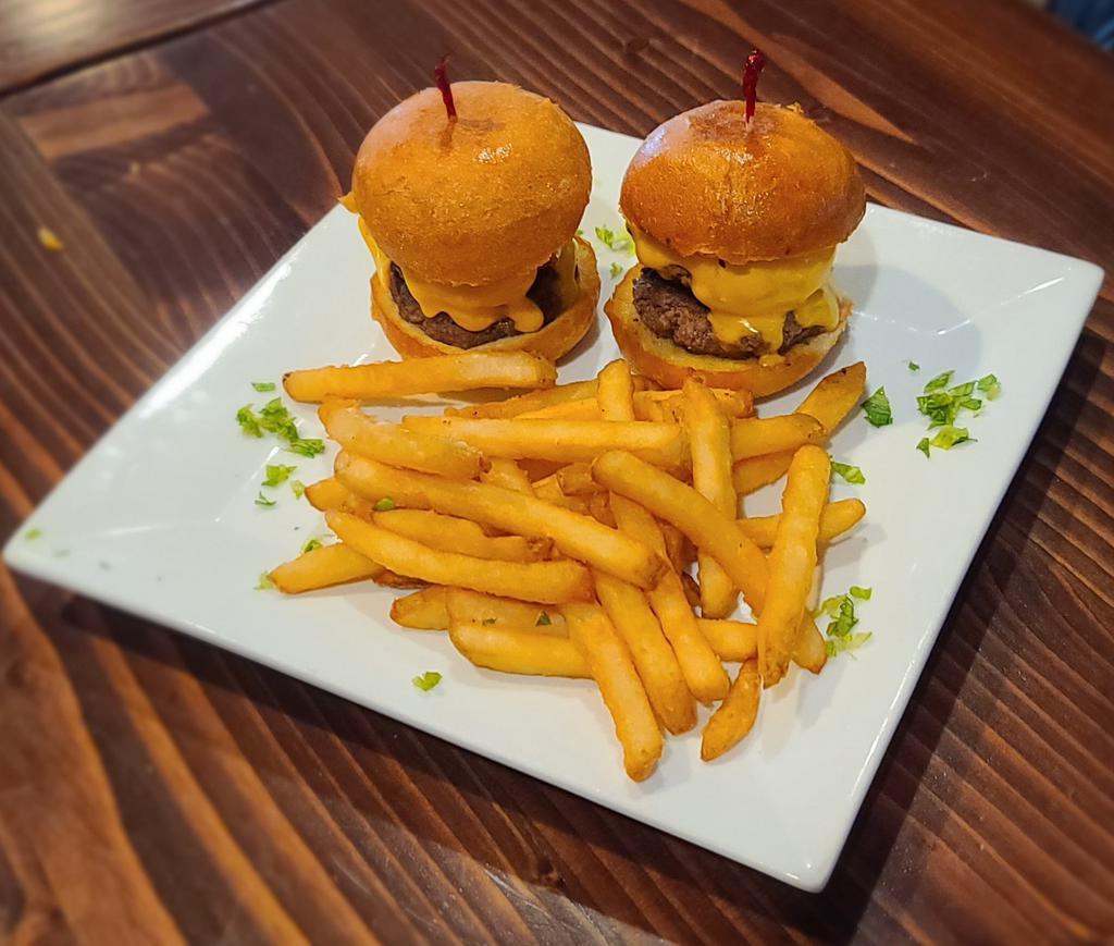 Smashed Burger Sliders · Order of 2 double patties topped with Lettuce, Tomatoes, Pickles on a toasted Brioche Bun. 
Note- due to the thickness of the burger patty, Rare, Medium Rare And Medium burger temps are unavailable as an option for these sliders. 