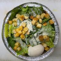 Caesar Salad · Crispy romaine lettuce, croutons, egg, Parmesan cheese and Caesar dressing.
