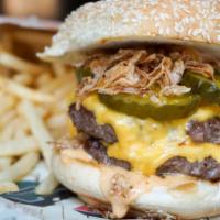 The Double Smashed Burger · Burger bash winner! 2 beef patties, American cheese, CH sauce, crispy shallots, bread and bu...