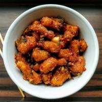 Baby Corn Manchurian · Deep fried battered baby corn cooked in Manchurian sauce.