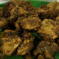 Pepper Chicken · Boneless fried chicken sautéed with black pepper, onions, and herbs.