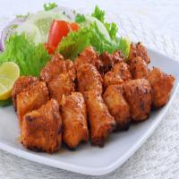 Chicken Tikka (8 Piece) · Boneless chicken breast marinated in tandoori spices and creamy yogurt and grilled.