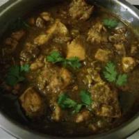 Gongura Chicken Curry · Gongura leaves and chicken cooked in onion-tomato sauce and finished with Indian spices.